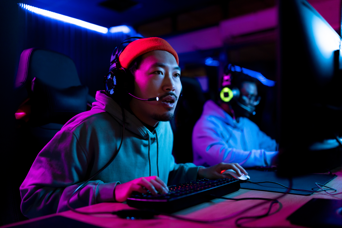A male gamer wearing a red hat